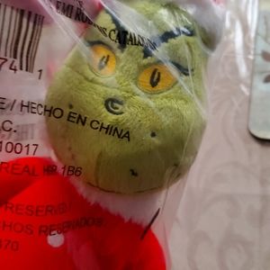 GRINCH  plushie that sings "your a mean one" 14 inch tall plus 3 inch cap.